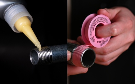 Yellow sealant is applied onto a metal pipe's threaded end; tape is wrapped around another pipe fitting. The background is dark, emphasizing the plumbing work.
