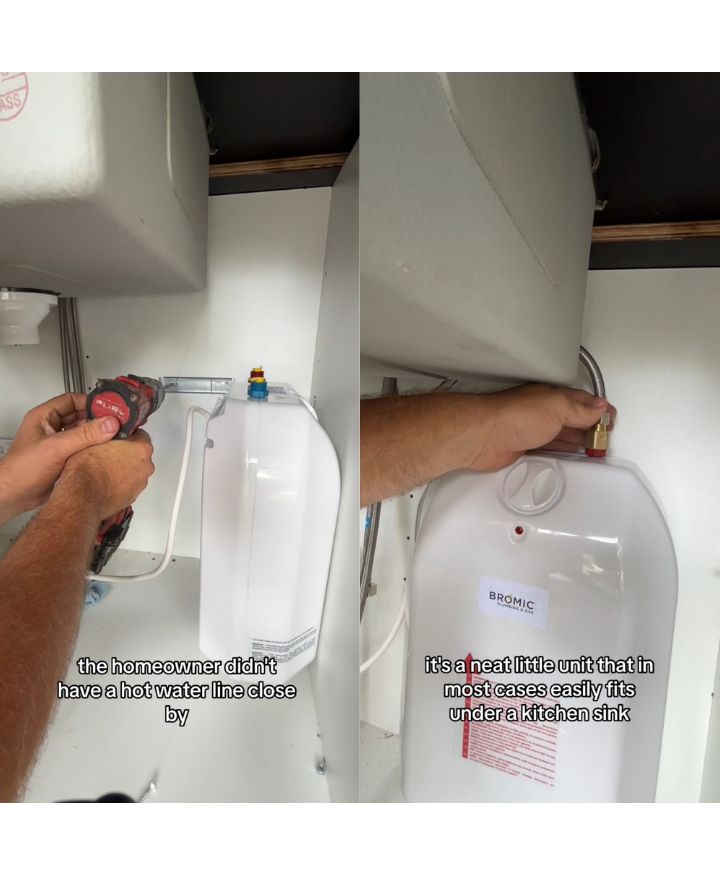 A person installs a small white water heater under a kitchen sink using a drill. Text reads: